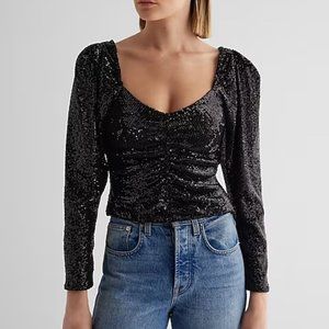 Sweetheart neckline Long puff sleeves Ruched front Sequin fabric; Lined Straight